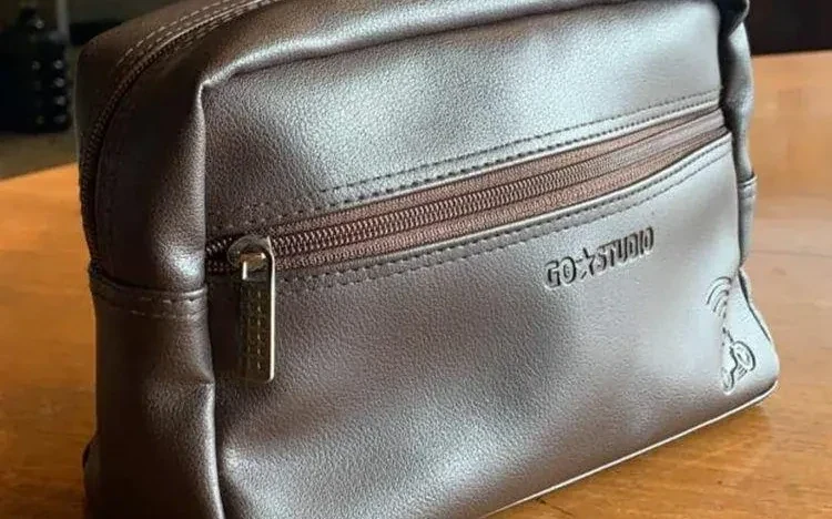 Leather toiletry bag for Gojek, embossed GoStudio logo