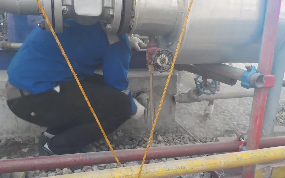Technician performing on-site pump maintenance